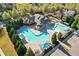 An aerial view of a neighborhood clubhouse and pools showcasing resort-style amenities with convenient parking at 3213 Blackley Old Rd, Douglasville, GA 30135