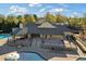 Overhead view of a clubhouse and pool featuring an expansive patio perfect for relaxation and community gatherings at 3213 Blackley Old Rd, Douglasville, GA 30135