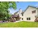 Expansive backyard with a deck, seating area, and lush green lawn at 3714 Westbrooke Ne Cir, Brookhaven, GA 30319
