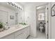 Traditional bathroom featuring a long vanity with large mirror and a separate enclosed toilet at 3714 Westbrooke Ne Cir, Brookhaven, GA 30319