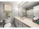 Bathroom featuring a white vanity, large mirror, and shower/tub combo with gray walls at 3714 Westbrooke Ne Cir, Brookhaven, GA 30319