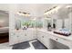 Bright bathroom features double sinks, vanity, large mirror and decorative window at 3714 Westbrooke Ne Cir, Brookhaven, GA 30319