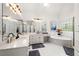 Bright bathroom with double sinks, soaking tub, shower, skylight and decorative window at 3714 Westbrooke Ne Cir, Brookhaven, GA 30319