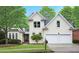 Charming two-story home featuring a manicured lawn, double garage, and classic architectural details at 3714 Westbrooke Ne Cir, Brookhaven, GA 30319