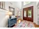 Grand foyer featuring a high ceiling, decorative rug, and stained-glass double doors at 3714 Westbrooke Ne Cir, Brookhaven, GA 30319