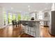 Bright and airy kitchen featuring an island with bar seating and a breakfast nook with large windows at 3714 Westbrooke Ne Cir, Brookhaven, GA 30319