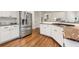 Modern kitchen with stainless steel refrigerator, granite countertops, and white cabinetry at 3714 Westbrooke Ne Cir, Brookhaven, GA 30319