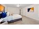 Bright main bedroom with neutral carpet, white walls, ceiling fan, and ensuite bathroom and closet at 3714 Westbrooke Ne Cir, Brookhaven, GA 30319