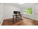 Well-lit home office with hardwood floors, perfect for remote work and productivity at 3714 Westbrooke Ne Cir, Brookhaven, GA 30319