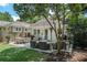 Charming backyard patio with outdoor seating and cozy string lights perfect for entertaining at 614 Cooledge Ne Ave, Atlanta, GA 30306