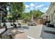 Backyard patio with outdoor furniture and a landscaped yard at 614 Cooledge Ne Ave, Atlanta, GA 30306