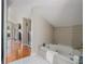 Bright bathroom with a soaking tub, marble floors, and an open floorplan at 614 Cooledge Ne Ave, Atlanta, GA 30306