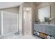 Modern bathroom featuring a vanity with a marble countertop, tile shower, and patterned floors at 614 Cooledge Ne Ave, Atlanta, GA 30306