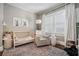 Cozy Bedroom with neutral walls, wood floors, and a crib at 614 Cooledge Ne Ave, Atlanta, GA 30306