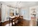 Bright dining room featuring hardwood floors, a stylish light fixture, and ample space for Gathering gatherings at 614 Cooledge Ne Ave, Atlanta, GA 30306
