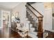 Inviting hallway with hardwood floors, staircase, and tasteful decor creating a warm and welcoming atmosphere at 614 Cooledge Ne Ave, Atlanta, GA 30306