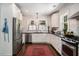 Modern kitchen with stainless steel appliances, white cabinets, and plenty of counter space for cooking and meal prep at 614 Cooledge Ne Ave, Atlanta, GA 30306