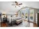 Bright main bedroom features a ceiling fan, balcony access, and hardwood floors at 614 Cooledge Ne Ave, Atlanta, GA 30306