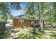 Brick home with lush backyard and inviting wooden deck surrounded by mature trees at 6718 Oakhurst Ct, Douglasville, GA 30134