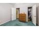 Cozy bedroom with closet and view of the en-suite bathroom offers storage and privacy at 6718 Oakhurst Ct, Douglasville, GA 30134