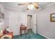 Bright bedroom with neutral walls, a ceiling fan and access to an adjoining bathroom at 6718 Oakhurst Ct, Douglasville, GA 30134