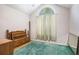 Bedroom with large arched window providing natural light and a classic headboard adds a vintage touch at 6718 Oakhurst Ct, Douglasville, GA 30134