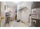 Functional laundry room with storage shelves, a window, and easy access to utilities at 6718 Oakhurst Ct, Douglasville, GA 30134