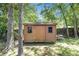 A charming backyard storage shed offers ample space for tools and equipment at 6718 Oakhurst Ct, Douglasville, GA 30134