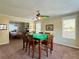 Spacious game room featuring a colorful ceiling fan and adjacent dining area with plenty of natural light at 6940 Treeline Dr, Cumming, GA 30028