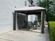 A gazebo with an outdoor dining set on the back patio of a well-maintained home at 6940 Treeline Dr, Cumming, GA 30028