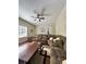 Large living room features lots of seating, neutral paint, dark wood floors, and lots of natural light at 6940 Treeline Dr, Cumming, GA 30028