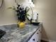 Close-up of vanity featuring a vessel sink, granite countertops, and modern fixtures at 6940 Treeline Dr, Cumming, GA 30028