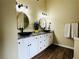Stylish bathroom vanity features double sinks and granite countertops and drawers for storage at 6940 Treeline Dr, Cumming, GA 30028