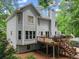 Home exterior presents a well-maintained deck, stairs, and lawn, creating an inviting outdoor space at 1172 Malvern Hunt Ct, Lawrenceville, GA 30043