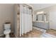 This bathroom shows a shower stall, toilet, and vanity, creating a functional and clean space at 1172 Malvern Hunt Ct, Lawrenceville, GA 30043
