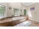 Bright bathroom showcases a tiled soaking tub with multiple windows for natural light and a decorative rug at 1172 Malvern Hunt Ct, Lawrenceville, GA 30043