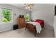 Bedroom with natural light that features windows with peaceful exterior views at 1172 Malvern Hunt Ct, Lawrenceville, GA 30043