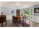 Formal dining room features gray walls, white trim, and large windows with natural light at 1172 Malvern Hunt Ct, Lawrenceville, GA 30043