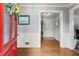 Inviting entryway featuring hardwood floors, wainscoting, and a view into other rooms at 1172 Malvern Hunt Ct, Lawrenceville, GA 30043