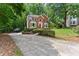 Charming two-story brick home featuring a manicured lawn and inviting red front door at 1172 Malvern Hunt Ct, Lawrenceville, GA 30043