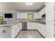 Functional kitchen with white cabinets, granite countertops, and stainless steel appliances at 1172 Malvern Hunt Ct, Lawrenceville, GA 30043