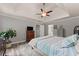 Serene main bedroom with trey ceilings, plenty of light, and soft gray walls at 1172 Malvern Hunt Ct, Lawrenceville, GA 30043