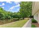 Scenic view of a serene pond within the community, perfect for relaxation and nature viewing at 1172 Malvern Hunt Ct, Lawrenceville, GA 30043