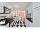 Well-equipped kitchen with stainless steel appliances and stylish checkerboard floors at 131 Lively St, Norcross, GA 30071