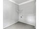 A simple laundry room with gray walls, light ceiling, and a fishnet decoration offers a practical utility space at 131 Lively St, Norcross, GA 30071