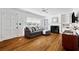 Cozy living room with hardwood floors, a fireplace, and a comfortable gray sofa at 131 Lively St, Norcross, GA 30071