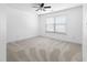 Bedroom featuring neutral walls, carpet, and a bright window at 1310 Scenic View Trce, Lawrenceville, GA 30044