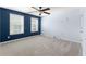Spacious bedroom featuring a ceiling fan and two bright windows at 1310 Scenic View Trce, Lawrenceville, GA 30044