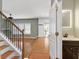 Entryway featuring stairs with wood floors and a half bathroom at 1310 Scenic View Trce, Lawrenceville, GA 30044