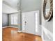 Inviting entryway with hardwood floors, a stylish mirror, and natural light, creating a warm welcome at 1310 Scenic View Trce, Lawrenceville, GA 30044